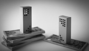 ビルの模型と札束